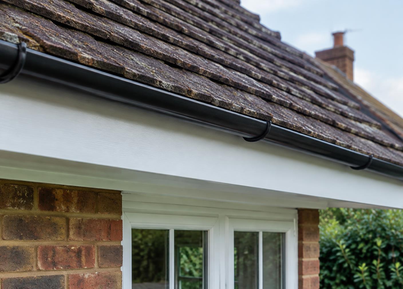 Fascia board detail beneath a tiled Surrey roof ready for local repair