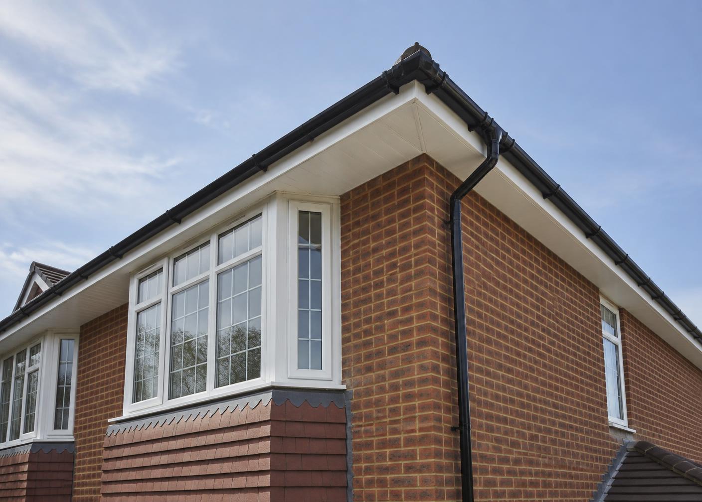 Completed white fascia and soffit replacement on a Surrey home